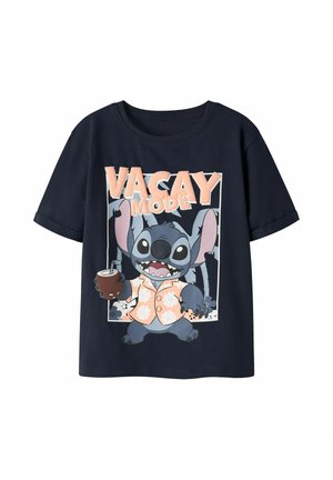 Navy blue T-shirt with cartoon character Stitch in a floral shirt holding a drink, text "VACAY MODE" above.