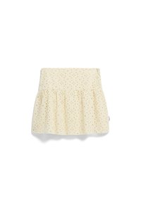 Jupe en coton jaune avec un design évasé, ornée d'un motif de pois dorés et d'une taille froncée. Texture lisse, longueur genou.