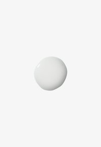 White circular paint blob with a smooth, glossy texture, on a plain white background.