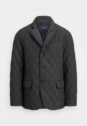 Blazer mat gris en matelassé avec revers cranté, trois boutons à l'avant, deux poches à rabat et une poche poitrine, étiqueté Polo Ralph Lauren.