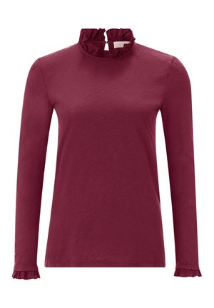 Haut à manches longues bordeaux avec un col montant froncé et des manches. Fabriqué en tissu doux, avec une texture lisse et une silhouette soignée.