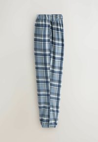 Blaue Karottenhose aus weichem Stoff. Sie hat einen elastischen Bund und schmal zulaufende Beine mit einer Mischung aus hellblau, dunkelblau, grau und cremefarbenen Streifen.