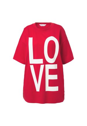 Red cotton t-shirt featuring a large white "LOVE" text design. Crew neck with short sleeves and a relaxed fit. Soft texture with straight hem.