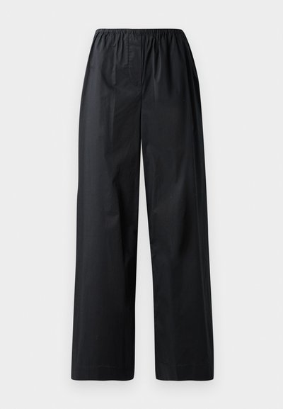 Black wide-leg trousers with an elastic waistband, featuring a smooth texture and no visible pockets or embellishments.