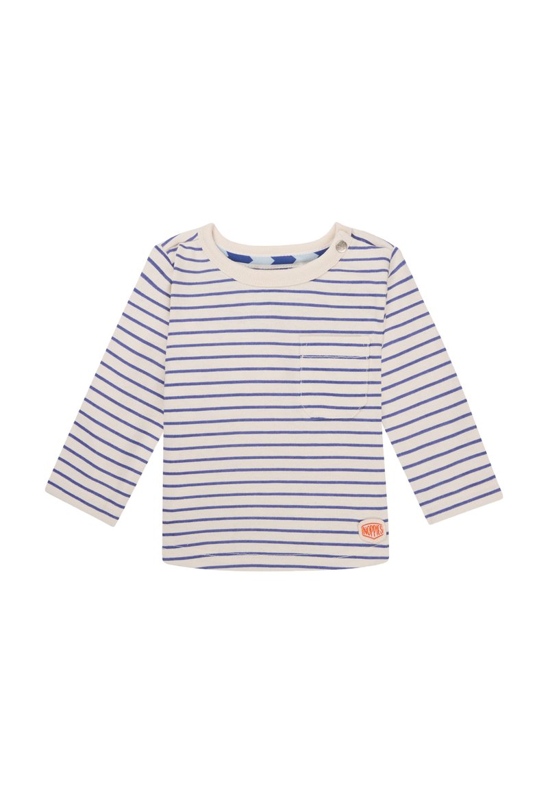 Chemise en coton crème à manches longues avec des rayures bleues, col rond, petite poche poitrine et une étiquette sur le bas à droite.