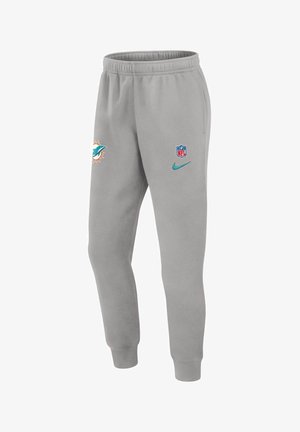 Lichtgrijze sweatpants met elastische tailleband, voorzien van het Miami Dolphins-logo, NFL-schild en Nike-swoosh in teal. Zachte textuur en taperende pasvorm.