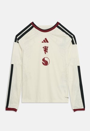 Hvid sportsjersey med lange ærmer med sorte striber på ærmerne, mørkerød krave og manchetter samt mørkerøde Adidas- og Manchester United-logoer foran.