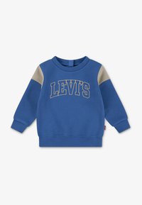 Blaues Sweatshirt mit beigen Schulterakzenten und gerippten Bündchen, mit goldenem "LEVI'S"-Logo. Hergestellt aus einem weichen Baumwollmischgewebe.