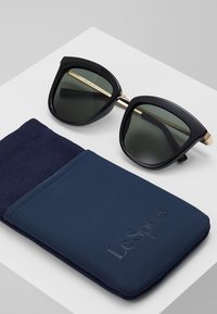 Le Specs CALIENTE  - Zonnebril - black/gold-coloured
