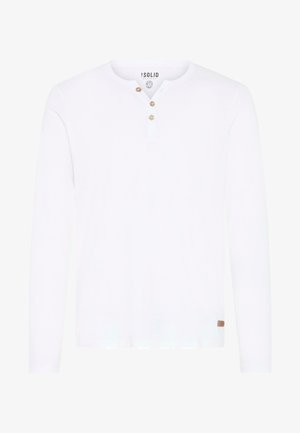 Long-sleeve white shirt made of cotton with a buttoned henley neckline and a small brown logo tag at the hem. Smooth texture.