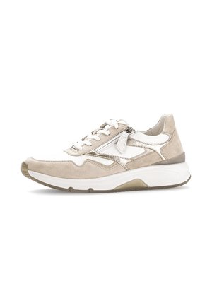 Beige sneakers with suede and leather materials, featuring white accents, lace-up closure, and a textured sole for grip.