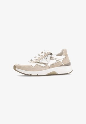 Beige sneakers with suede and leather materials, featuring white accents, lace-up closure, and a textured sole for grip.