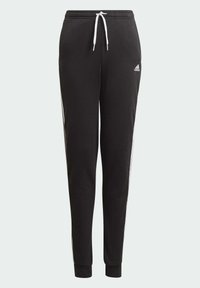 Pantalones de chándal negros hechos de un material suave, con cordón blanco, rayas laterales y puños en los tobillos. Logotipo en el muslo izquierdo.