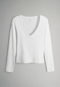 Maglietta bianca a maniche lunghe con scollo a V in tessuto rigato. Presenta un design crop con una finitura liscia e cuciture pulite.