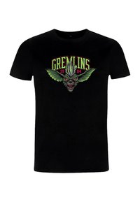 Černé tričko s barevným motivem s designem gremlina, zelenými křídly a nápisem "GREMLINS 1984" v červené a zelené barvě.
