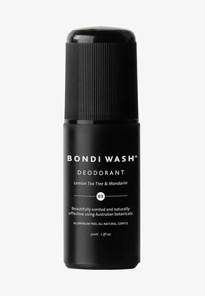 Black cylindrical deodorant container with textured cap. White text label reads "Bondi Wash Deodorant Lemon Tea Tree & Mandarin." 50ml.