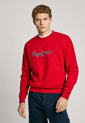 Red sweatshirt with long sleeves, round neck, and "Pepe Jeans London" logo in black. Fabric appears soft with a smooth texture.
