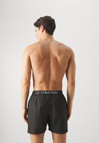Calvin Klein Swimwear DRAWSTRING - Badeshorts - black