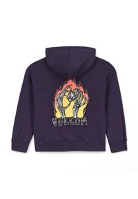 Felpa viola con grafica sulla schiena che raffigura mani scheletriche che tengono un diamante, circondate da fiamme, con la parola "VOLCOM" in un carattere audace.