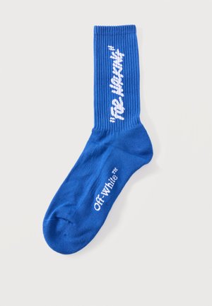 Calcetín de canalé azul con texto blanco "Ice Cream" en el lateral y logotipo "Off-White™" impreso en el pie.