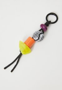 Colorful keychain featuring a mix of round and triangular beads in yellow, orange, purple, and black, strung on a black braided cord.