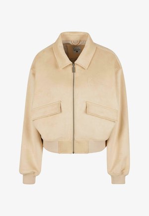 Beige Jacke, tailliert, aus weichem Material, mit einem Reißverschluss vorne, zwei Taschen mit Klappen, gerippten Bündchen und einem gestickten Logo.