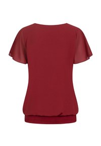 Rode blouse met korte, doorschijnende fladdermouwen, ronde hals en elastische zoom. Glad materiaal met een relaxte pasvorm. Alleen een achteraanzicht.