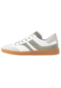 White sneaker with olive green suede stripes, light gray suede toe and heel, beige sole, and white laces, shown in side view.