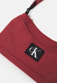 Calvin Klein Jeans CITY SHOULDER BAG - Borsa a tracolla - terracotta tile