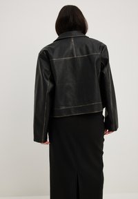 NA-KD Faux leather jacket - black