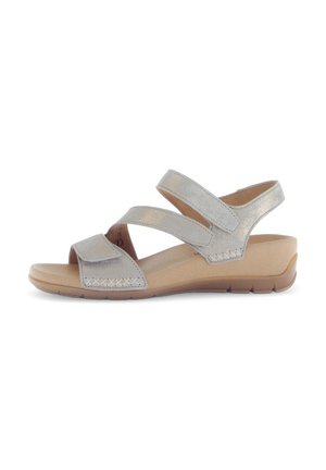Silver metallic sandals with two adjustable straps, flat sole, and textured detailing on the band; lightweight design for comfort.