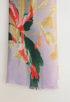 Floral scarf in soft fabric features vibrant red, green, and gold patterns on a light purple background, with fringed edges.