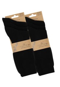 Calzini di cotone neri in confezione da due, con una texture a coste e una manica di cartone etichettata "Clark Crown Calzini 100% Cotone." Taglia 39-42.