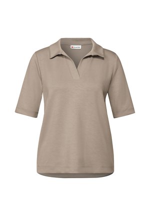 Polo beige con maniche corte, vestibilità rilassata e colletto con design a V. Realizzato in un tessuto morbido e texture.