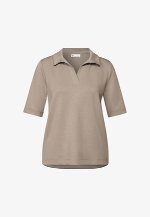 Beige polo-paita lyhythihaisena, rentona istuvuutena, ja kauluksessa V-muotoinen design. Valmistettu pehmeästä, teksturoidusta kankaasta.