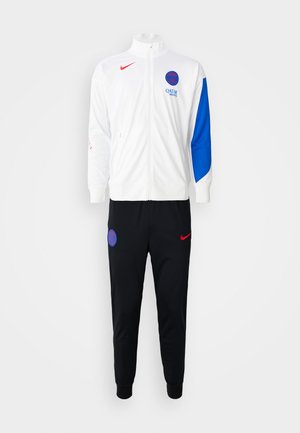Track suit featuring a white zip-up jacket with blue sleeve accents, red Nike logo, and black pants with blue circular logo and red details.