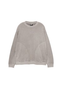 Felpa oversize grigia chiara, con colletto tondo, spalle scese e cuciture laterali curve. Realizzata in morbido cotone.