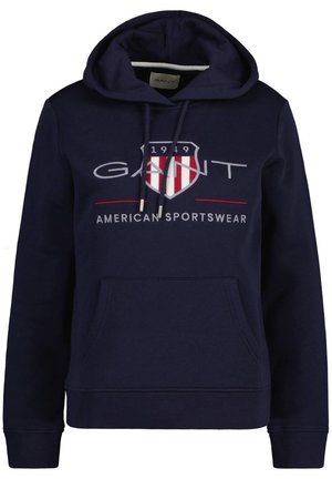Marineblauwe hoodie van een katoenmix, met een voorzak, verstelbare trekkoordkap, en grafische logo met schildontwerp.