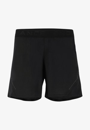 Sorte atletiske shorts med en blød talje, kort længde og diskrete side detaljer med mesh for åndbarhed.