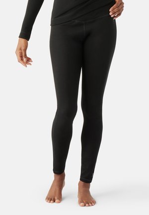 Black leggings made of soft, stretchy fabric, featuring a fitted design and seamless sides, with a subtle logo at the ankle.