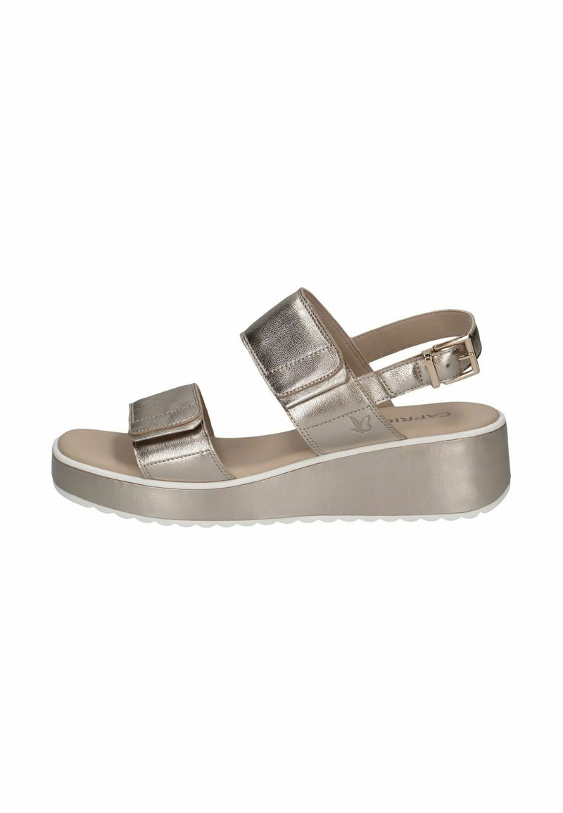 Sandali platform metallici argento con due cinturini regolabili e un plantare imbottito; suola in gomma bianca con un motivo testurizzato.