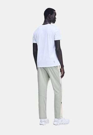 On, WEATHER PANTS. - Pantalon de survêtement - hare brume