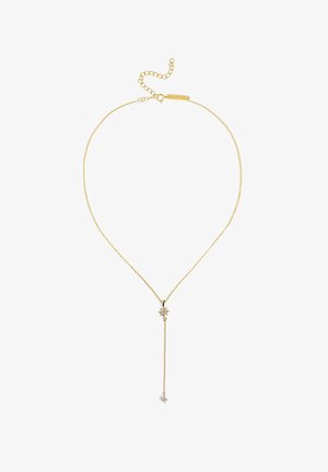 Złoty naszyjnik z cienkim łańcuszkiem, ozdobiony wisiorkiem w kształcie gwiazdy oraz dwoma zwisającymi akcentami o różnych długościach. Łańcuszek posiada regulowane zapięcie.