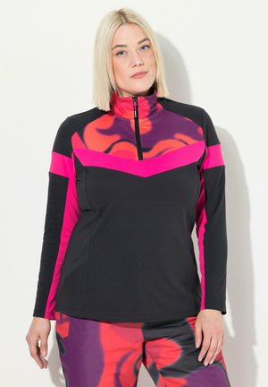 Langermige sporttop in zwart met roze strepen en een hoge kraag. Heeft een grafische print in tinten roze en paars op de borst.