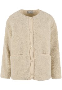 Jakna od kremastog flisa s teksturiranom vanjštinom, okruglim izrezom i dva prednja džepa. Kopčanje na drukere i prešani unutarnji sloj.