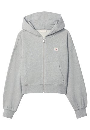 Svetlosivá krátka mikina na zips s prednými vreckami, elastickými lemami a malým logom Calvin Klein na ľavej strane hrude.