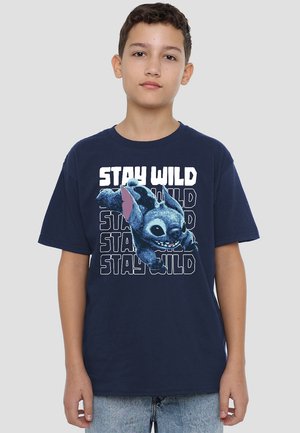 Navy blue cotton t-shirt featuring a graphic design of a playful cartoon character with the text "STAY WILD" in bold white font.