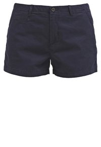 Pantalones cortos de algodón azul marino con cierre de botón, bolsillos frontales y un corte ajustado. Presentan detalles de costura a lo largo de los bolsillos.