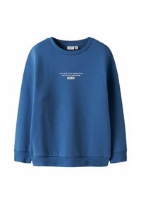 Sweat-shirt bleu à col rond avec poignets et ourlet côtelés, arborant un texte blanc "LA VOIX DE MA GÉNÉRATION FAISONS-LE DEMAIN DEPUIS 1986" sur le devant.