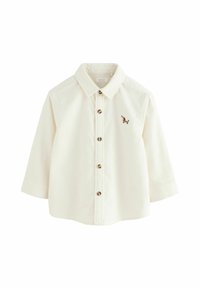 T-shirt crème à manches longues pour tout-petit avec col, devant à boutons et petit teckel brodé marron sur la poitrine gauche.